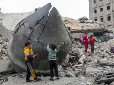 Children play in the rubble of Al-Faruq Mosque, which was destroyed by Israeli bombardment, in Rafah, southern Gaza Strip, on March 17, 2024.