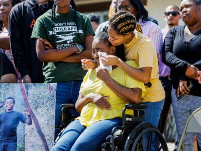 Rebecca Gainer, sister of slain Ryan Gainer, comforts her mother Sharon Hayward during a press conference announcing a lawsuit against the San Bernardino County Sheriff's Department on March 21, 2024, in Apple Valley, California.