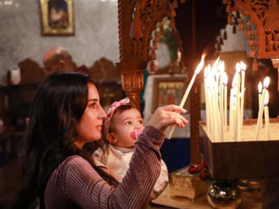 Palestinian Christians celebrate Palm Sunday with a ritual at Church of Saint Porphyrius amid Israeli attacks in Gaza City, Gaza, on March 24, 2024.