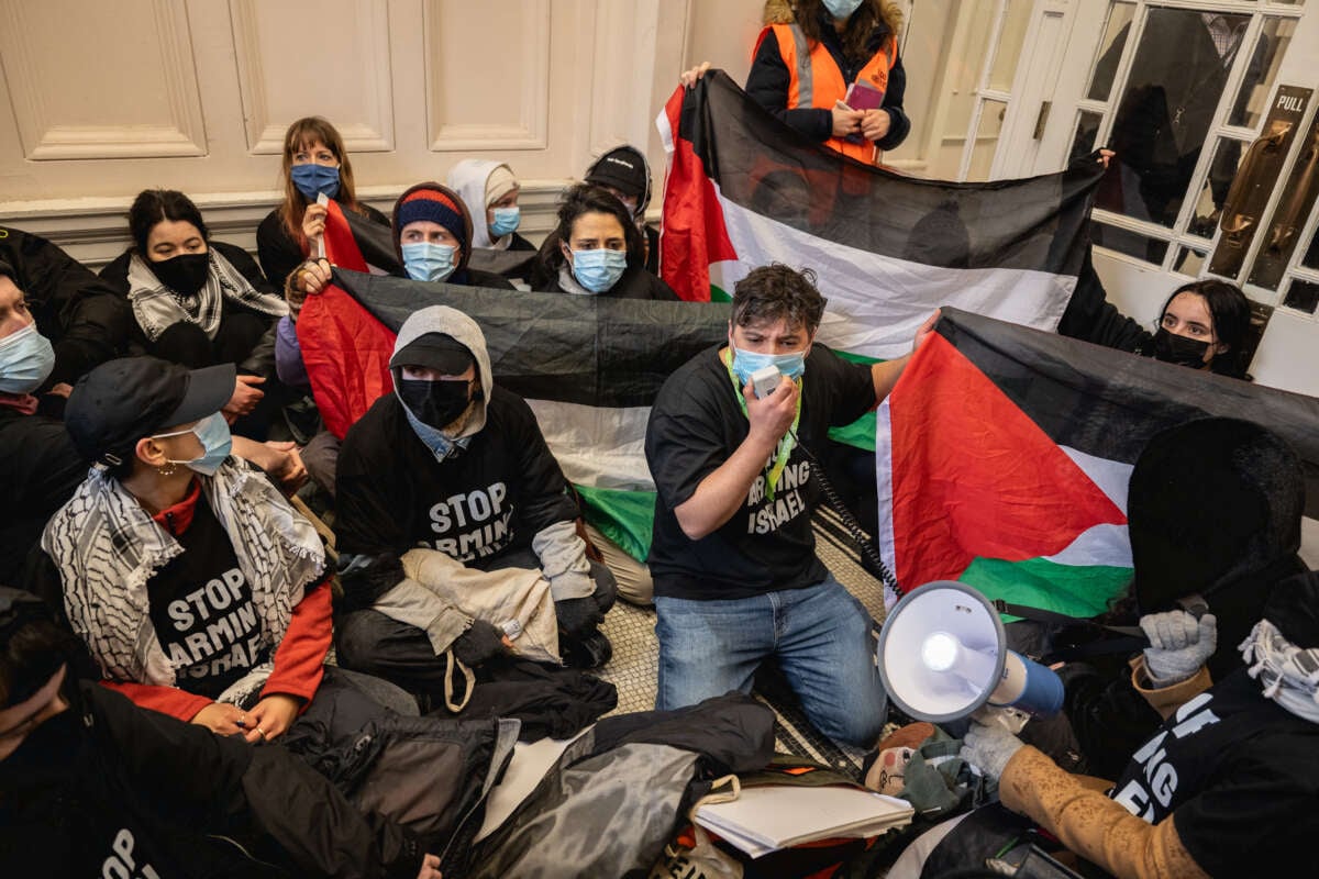Supporters of London for a Free Palestine occupy the foyer of the Department of Business and Trade in protest over the granting of export licenses to arms companies supplying the Israeli military on March 28, 2024, in London, England.