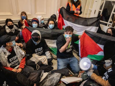Supporters of London for a Free Palestine occupy the foyer of the Department of Business and Trade in protest over the granting of export licenses to arms companies supplying the Israeli military on March 28, 2024, in London, England.