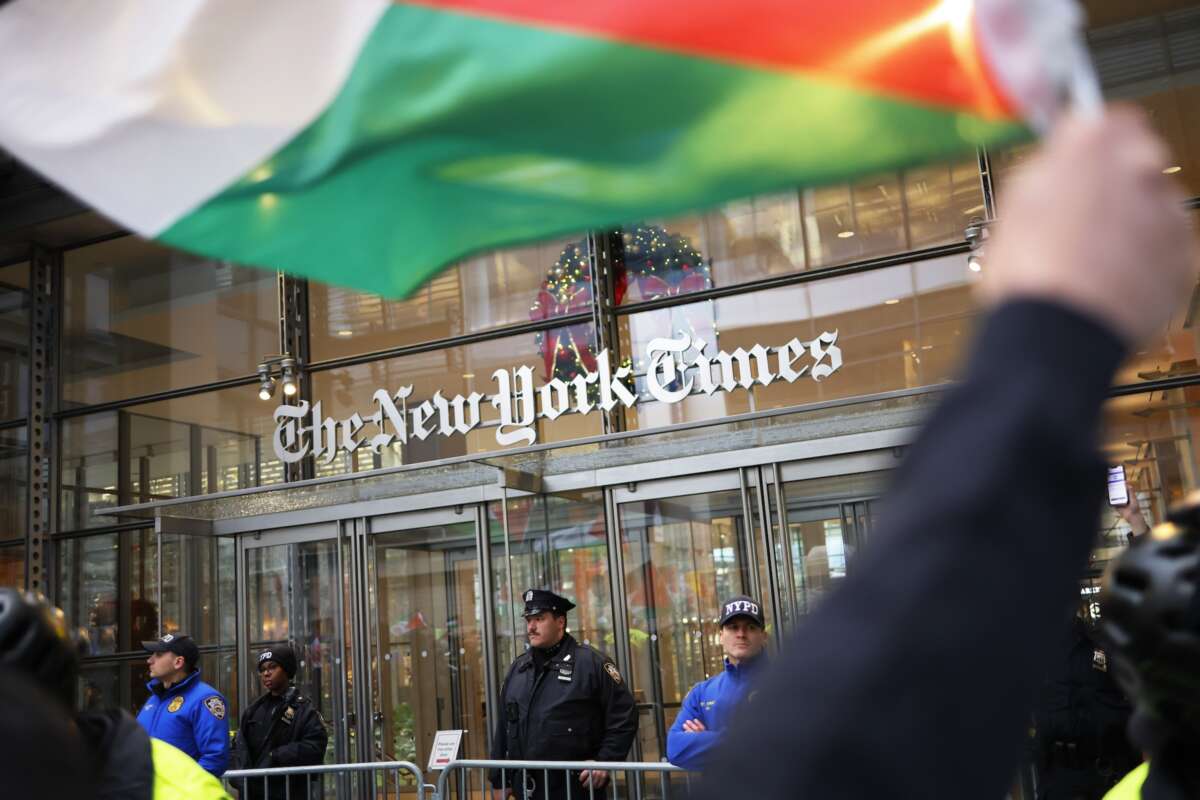 Pro-Palestine activists march in front of the New York Times headquarters as they participate in a Global Strike for Gaza on December 18, 2023 in New York City, New York.