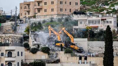 Israeli military excavators demolish the house of the Palestinian Shuqairat family, which was reportedly built without a construction permit, in the Jabal Mukaber neighbourhood of Israeli-annexed east Jerusalem on January 3, 2024.