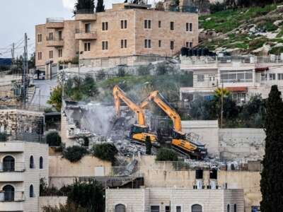 Israeli military excavators demolish the house of the Palestinian Shuqairat family, which was reportedly built without a construction permit, in the Jabal Mukaber neighbourhood of Israeli-annexed east Jerusalem on January 3, 2024.