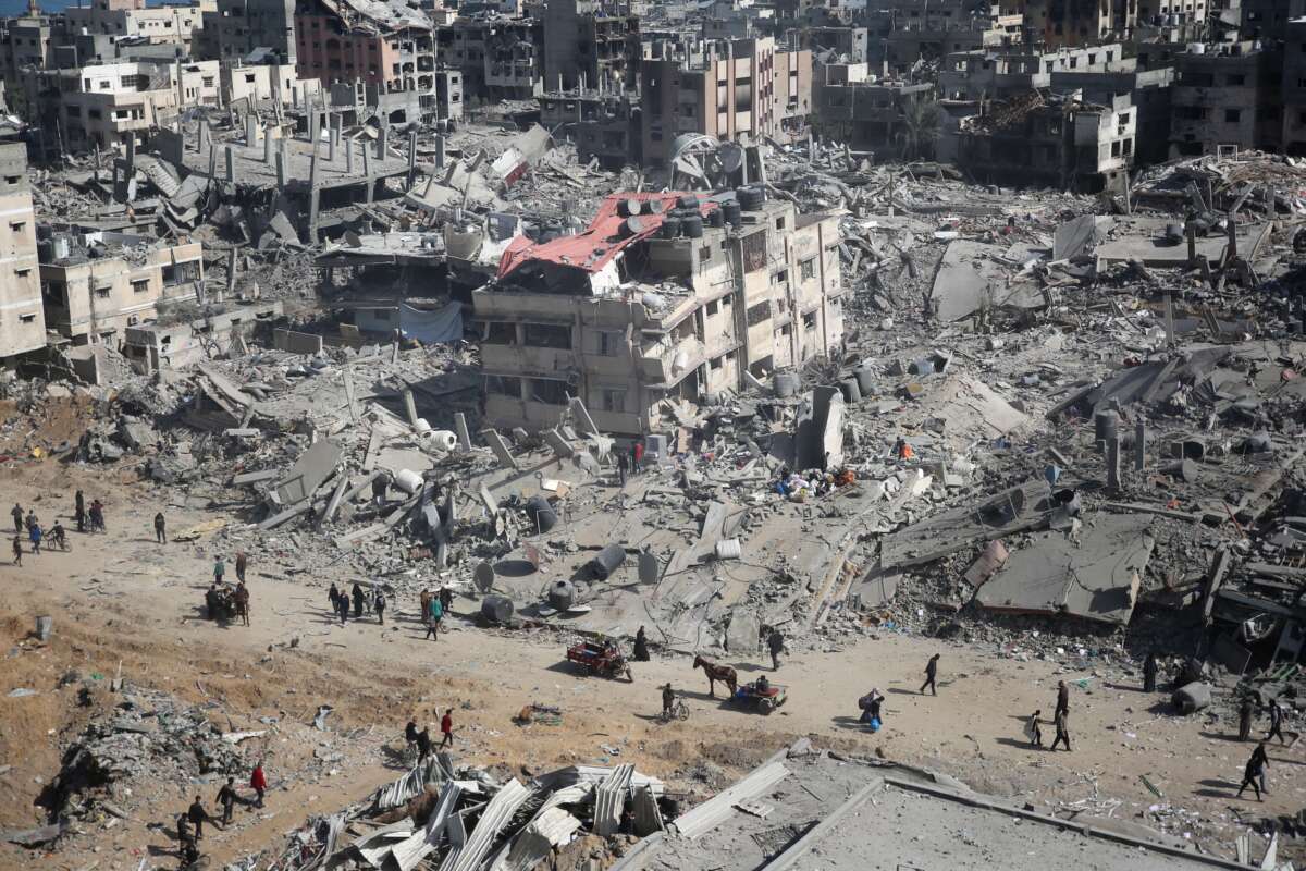 Palestinians inspect the damage in the area around Gaza's Al Shifa hospital after the Israeli military withdrew on April 1, 2024.