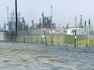 Floodwaters cover an access road to oil refineries on September 25, 2005, in Port Arthur, Texas, in the aftermath of Hurricane Rita.