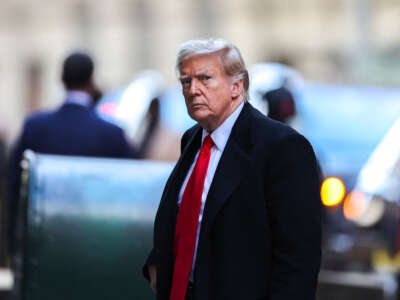 Former President Donald Trump arrives at 40 Wall Street after his court hearing to determine the date of his trial for allegedly covering up hush money payments linked to extramarital affairs in New York City, on March 25, 2024.