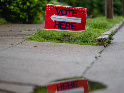 A VOTE HERE sign is displayed during Kentucky Primary Elections at Deer Park Baptist Church on May 16, 2023, in Louisville, Kentucky.