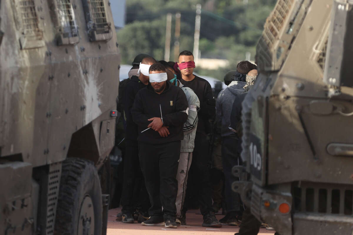 Israeli forces detain a number of Palestinians as they raid Tulkarm refugee camp in Tulkarm, West Bank, on January 18, 2024.