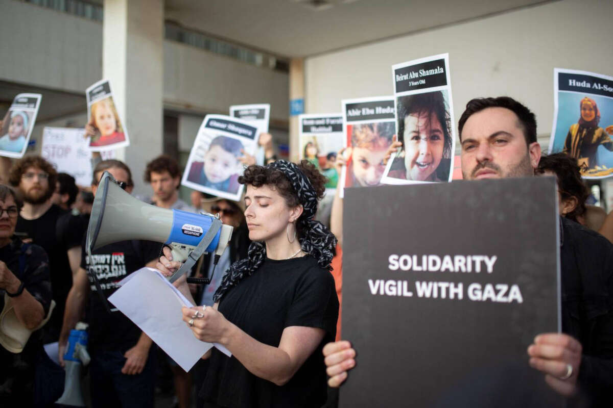 Protesters gather outside of the U.S. embassy in Tel Aviv. Activists are reading aloud the names of some of the victims of Israel's assault of Gaza.