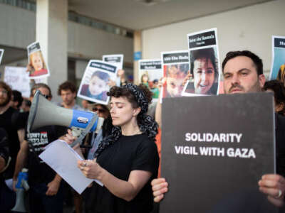 Protesters gather outside of the U.S. embassy in Tel Aviv. Activists are reading aloud the names of some of the victims of Israel's assault of Gaza.