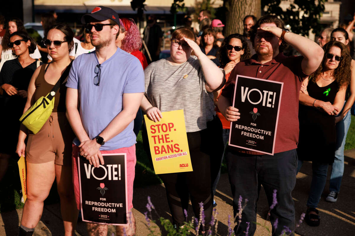 Abortion rights activists gather at the Monroe County Courthouse for a protest vigil a few hours before Indiana's near total abortion ban goes into effect in Bloomington, Indiana, on September 15, 2022.