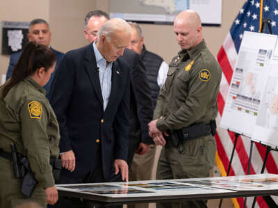 President Joe Biden looks at a presentation about immigration and border security at the Brownsville Station on February 29, 2024, in Olmito, Texas.