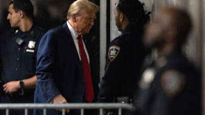 Former President Donald Trump returns from a break in his criminal trial for allegedly covering up hush money payments at Manhattan Criminal Court on April 25, 2024, in New York City.