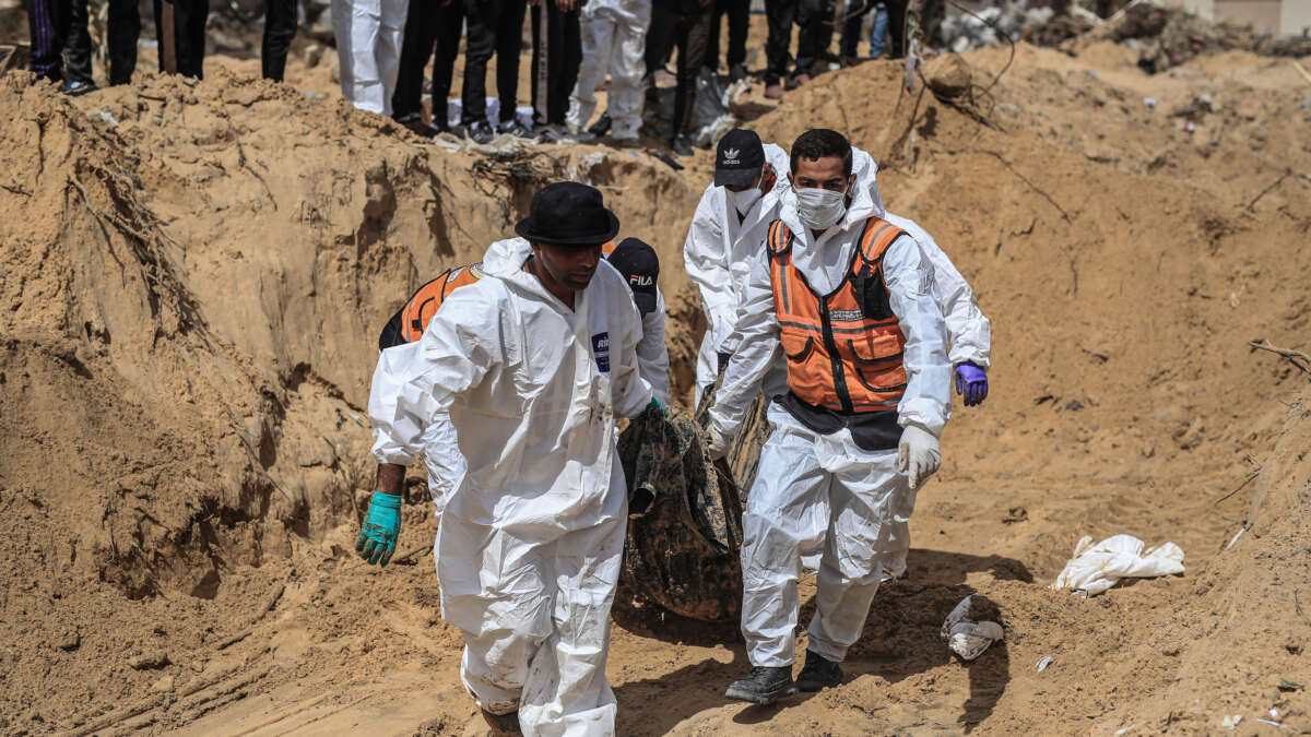 Civil Defence Authority teams work to recover bodies of Palestinians from under the rubble in Khan Yunis, Gaza, on April 21, 2024. The Palestinian Civil Defense Administration in the Gaza Strip said late Saturday that the bodies of 50 Palestinians killed by the Israeli army were recovered from a mass grave in the southern Khan Younis province.