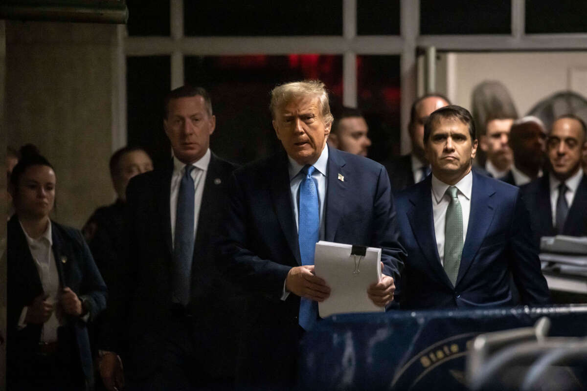 Former President Donald Trump, with attorney Todd Blanche (right), walks toward the press to speak as he arrives at his trial for allegedly covering up hush money payments linked to extramarital affairs, at Manhattan Criminal Court in New York City on April 26, 2024.