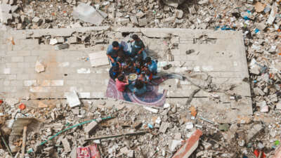 Palestinians, returning to Khan Yunis, are viewed around the wreckage, in Khan Yunis of Gaza on April 26, 2024.