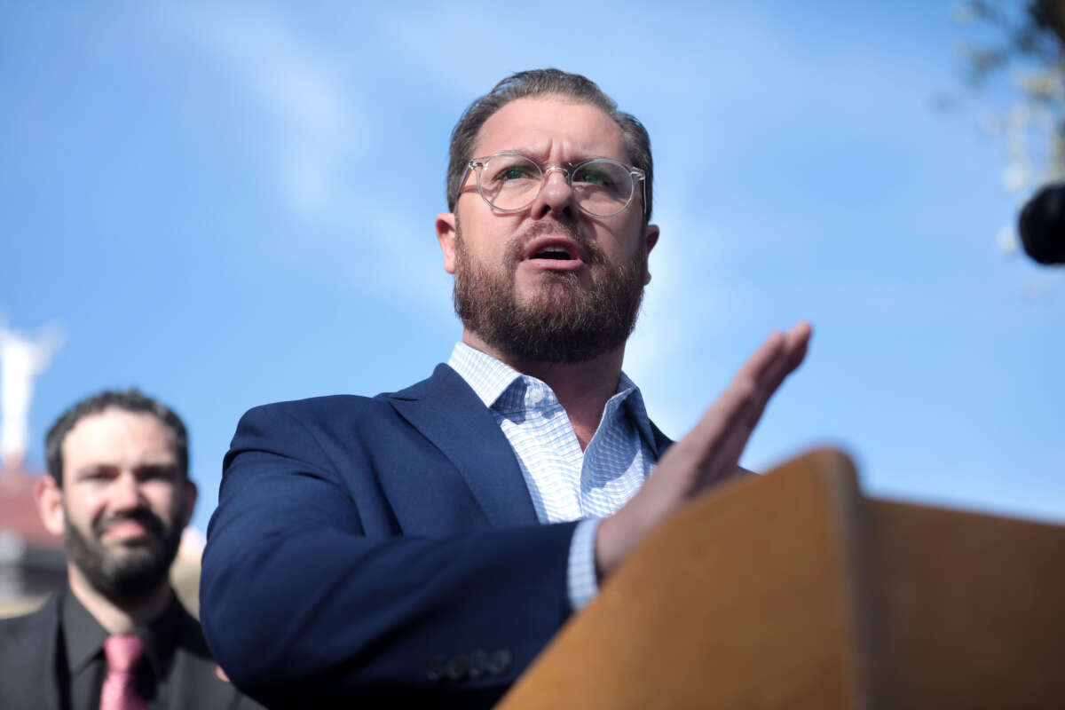 State Senator Jake Hoffman speaking with the media outside the Arizona State Capitol building on January 9, 2023, the opening day of the 56th Legislature in Phoenix, Arizona.