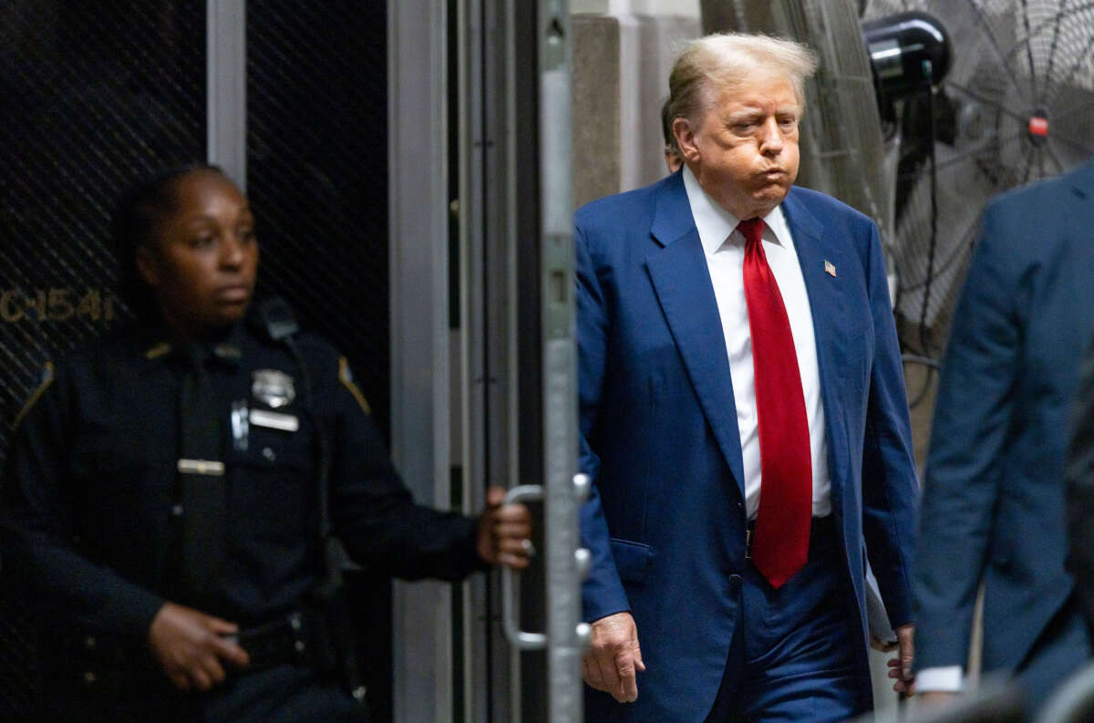 Former President Donald Trump returns to the courtroom following a break during his trial for allegedly covering up hush money payments at Manhattan Criminal Court on April 30, 2024, in New York City.