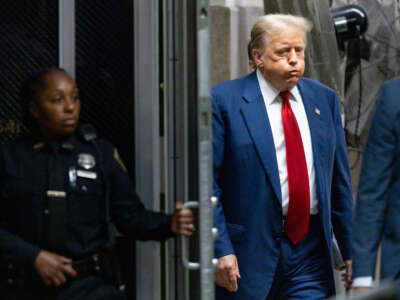Former President Donald Trump returns to the courtroom following a break during his trial for allegedly covering up hush money payments at Manhattan Criminal Court on April 30, 2024, in New York City.