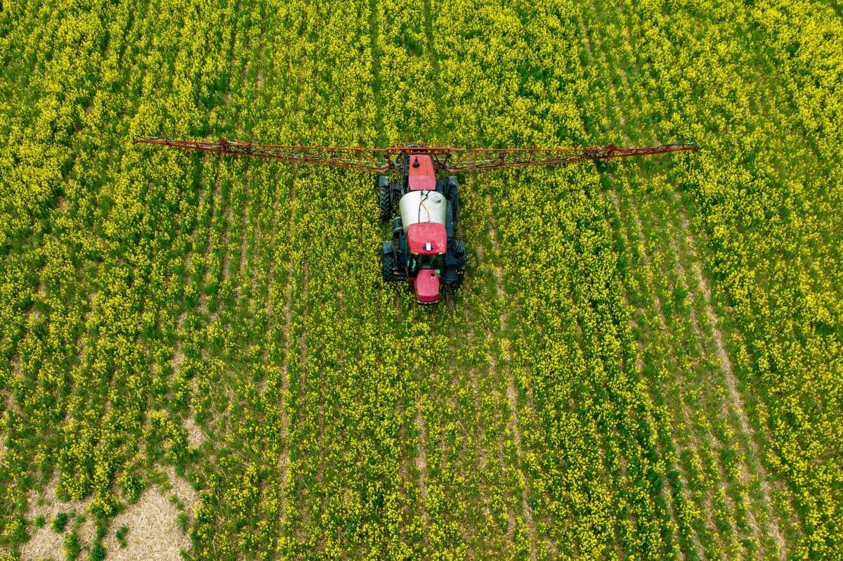 A farmer spreads pesticide on a field in Centreville, Maryland, on April 25, 2022.