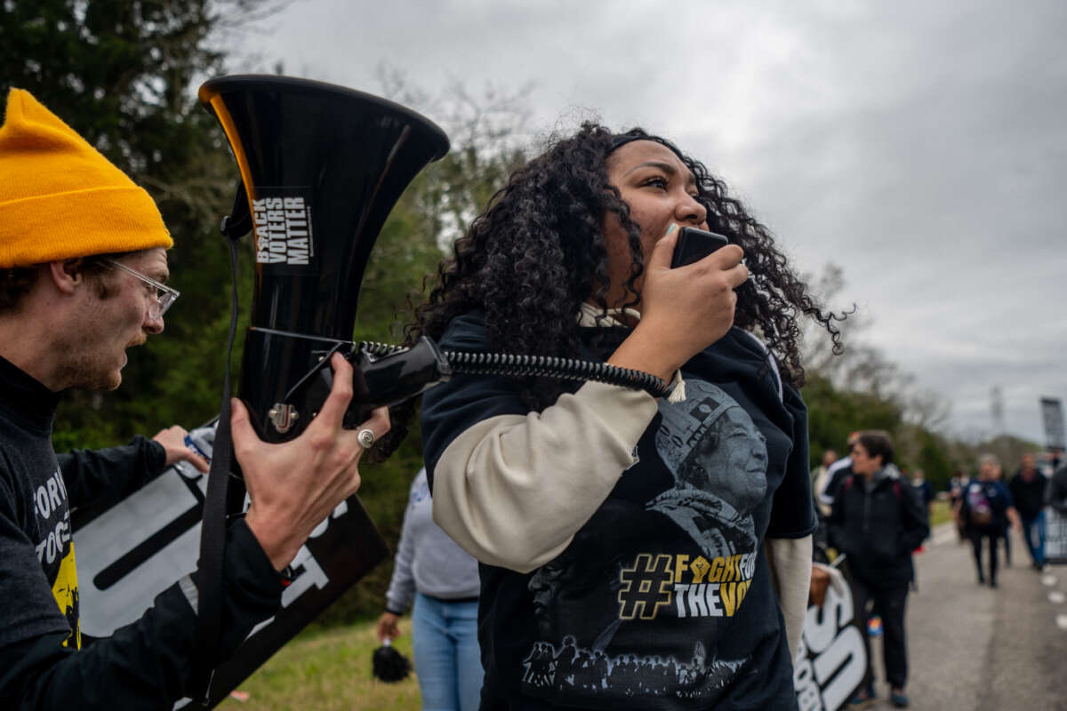 Marchers lead chants during a Black Voters Matter march