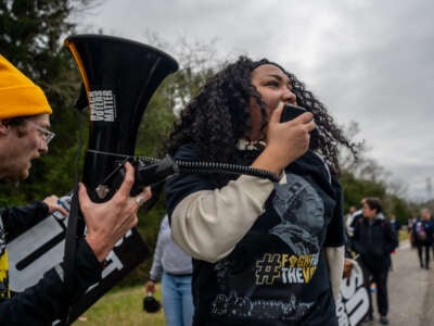 Marchers lead chants during a Black Voters Matter march