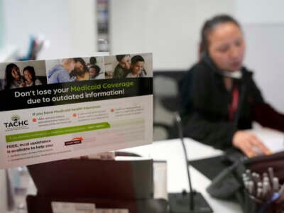 A reminder about Medicaid coverage is displayed as Trina Le, eligibility supervisor team lead, works at Hope Clinic on May 30, 2023, in Houston, Texas.