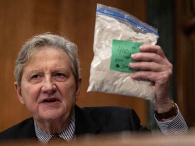 U.S. Senator John Kennedy holds up a bag representing fentanyl during a Senate Banking, Housing, and Urban Affairs Committee hearing in Washington, D.C., on January 11, 2024.