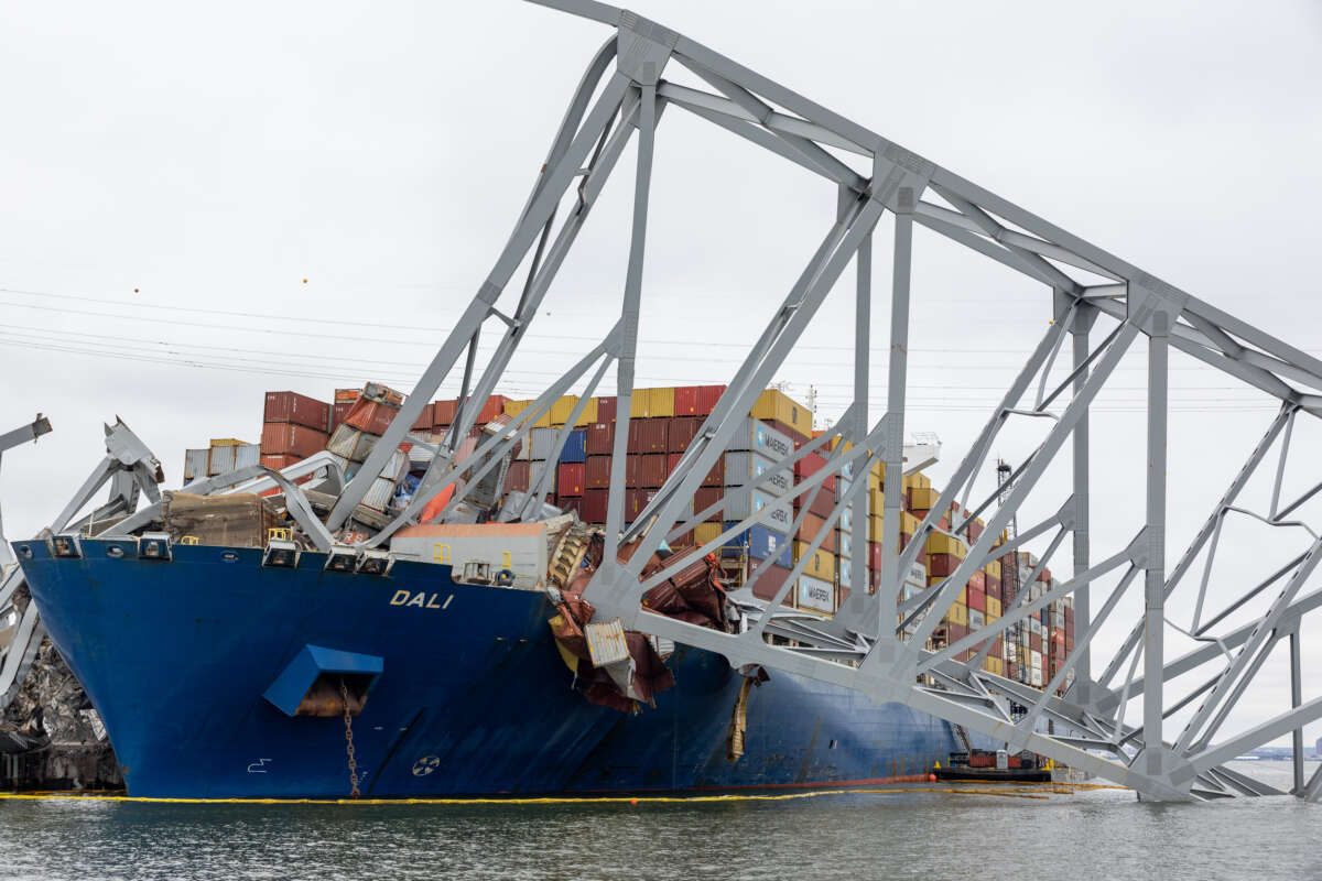 Wreckage from the collapsed Francis Scott Key Bridge rests on the cargo ship Dali as efforts begin to clear the debris and reopen the Port of Baltimore on April 1, 2024, in Baltimore, Maryland.