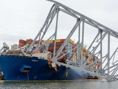 Wreckage from the collapsed Francis Scott Key Bridge rests on the cargo ship Dali as efforts begin to clear the debris and reopen the Port of Baltimore on April 1, 2024, in Baltimore, Maryland.