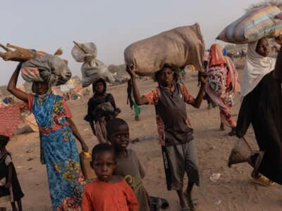 Newly arrived refugees from Darfur, in Sudan, head to their shelters on April 24, 2024, in Adre, Chad.