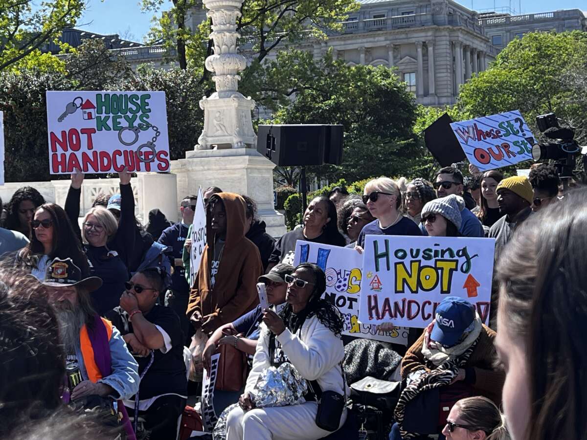Demonstrators from across the country listen to speakers in front of the U.S. Supreme Court as the debate on criminalizing homelessness unfolded inside.