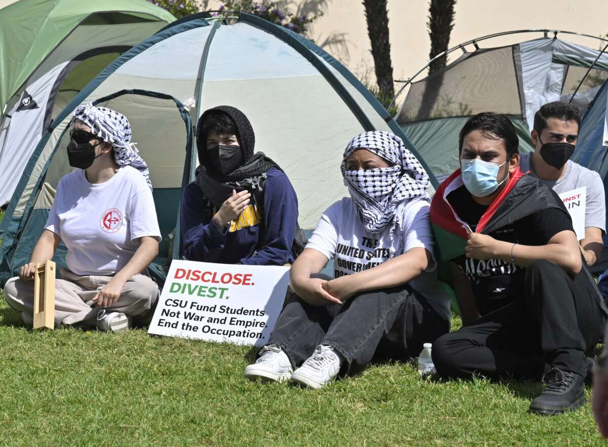 Students for Justice in Palestine rally with speeches, signs and demands at Cal State LA in Los Angeles on Wednesday, May 1, 2024.