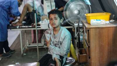 An injured Palestinian boy awaits treatment at the Kuwaiti hospital following Israeli strikes in Rafah in the southern Gaza Strip on May 7, 2024.