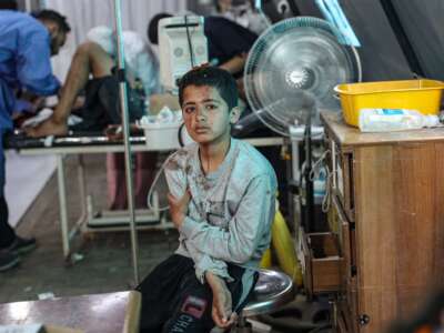 An injured Palestinian boy awaits treatment at the Kuwaiti hospital following Israeli strikes in Rafah in the southern Gaza Strip on May 7, 2024.