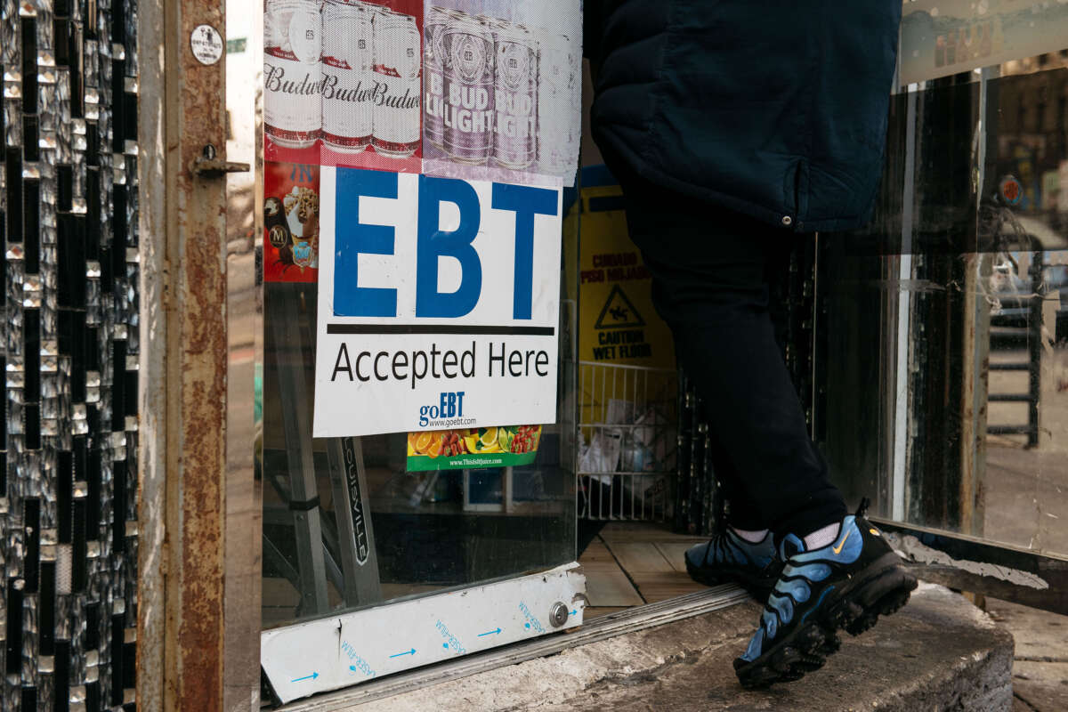 A sign alerting customers about SNAP food stamps benefits is displayed at a Brooklyn grocery store on December 5, 2019, in New York City.