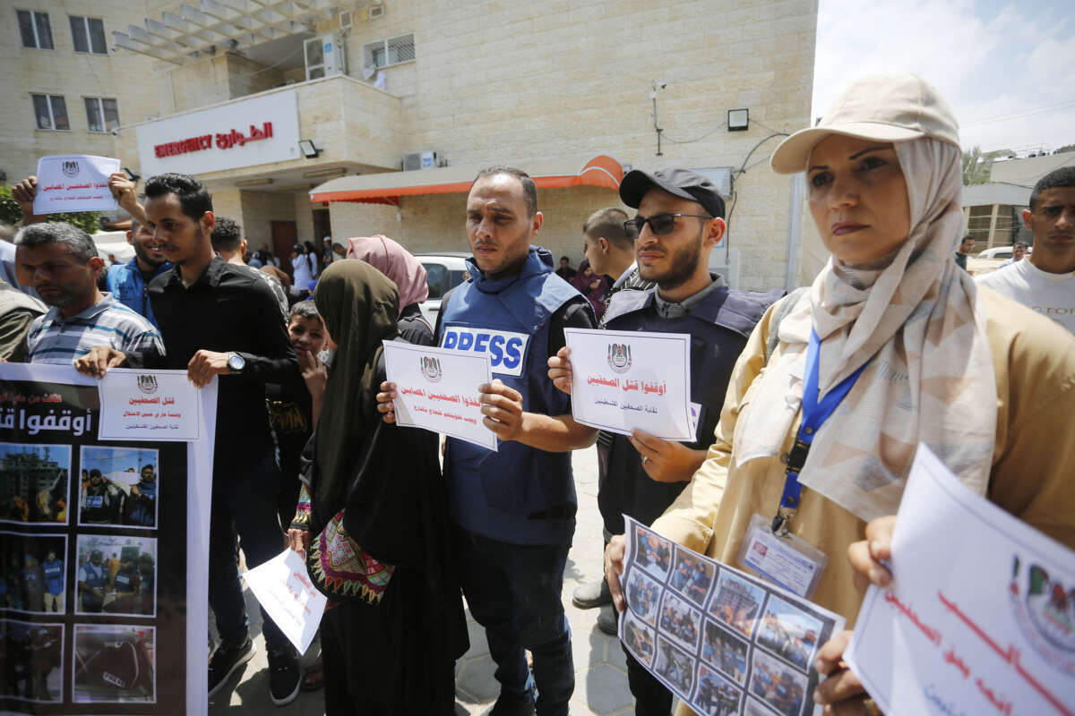 Press members gather to stage a demonstration in front of the Aqsa Martyrs Hospital to commemorate World Press Freedom Day in Deir-Al Balah, Gaza, on May 2, 2024.