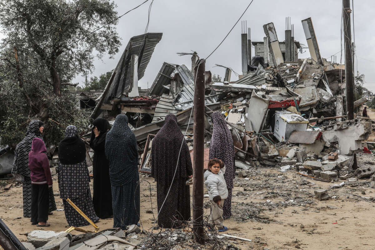 Palestinians inspect a damaged house after Israeli warplanes bombed buildings in Rafah, on May 6, 2024.