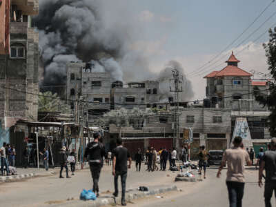 Smoke rises from shopping center following an Israeli airstrike on east of Rafah, Gaza, on May 7, 2024.