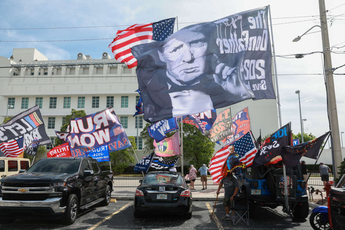 Supporters of former President Donald Trump stand outside of the Alto Lee Adams Sr. U.S. Courthouse on March 1, 2024, in Fort Pierce, Florida.