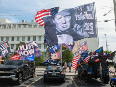 Supporters of former President Donald Trump stand outside of the Alto Lee Adams Sr. U.S. Courthouse on March 1, 2024, in Fort Pierce, Florida.