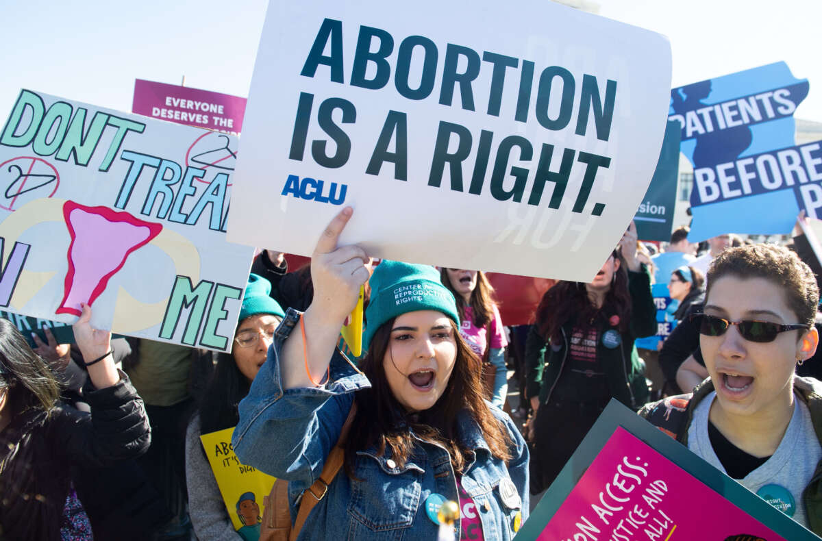 Pro-choice activists supporting legal access to abortion protest during a demonstration outside the Supreme Court in Washington, D.C., March 4, 2020.