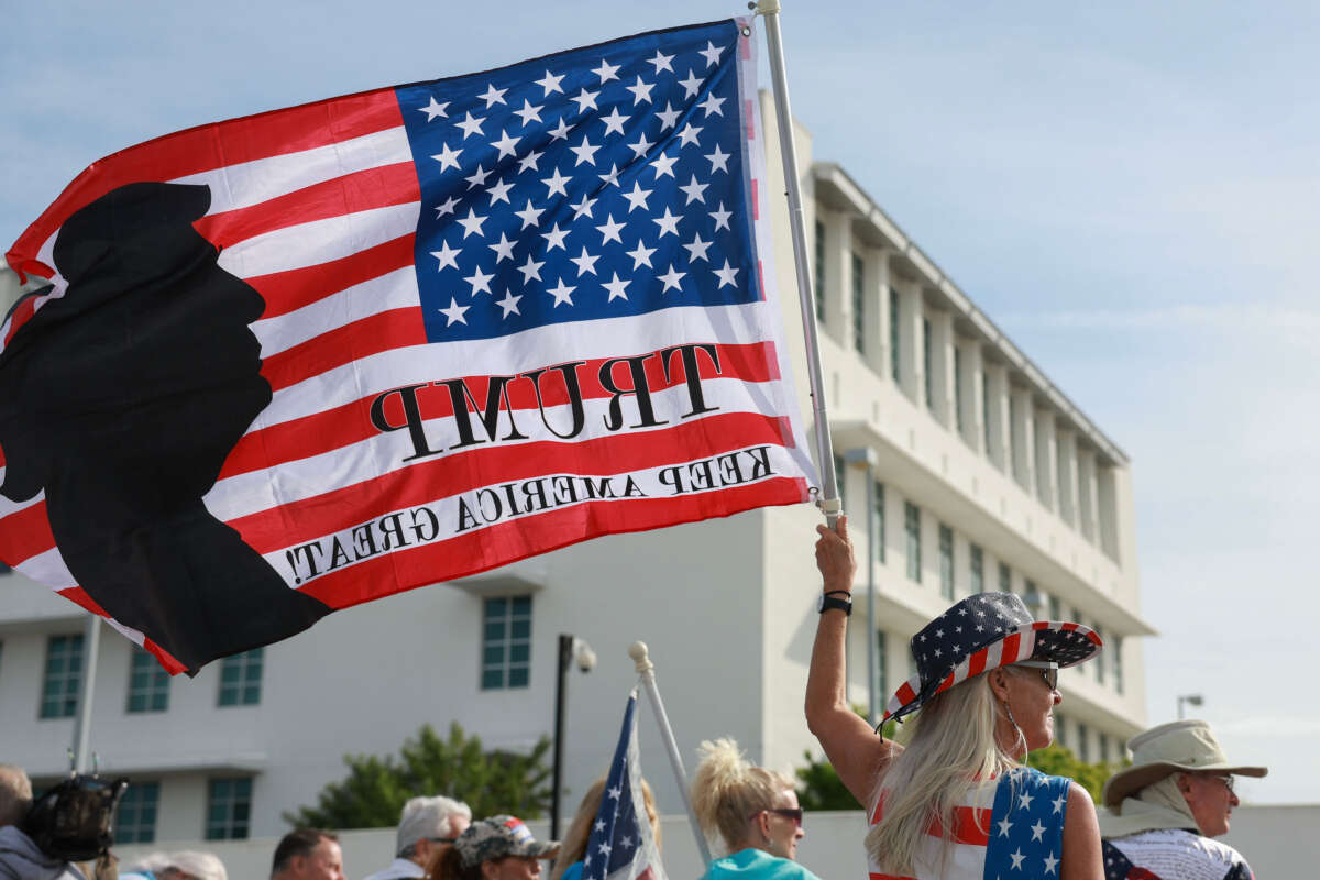 Supporters of former President Donald Trump stand outside of the Alto Lee Adams Sr. U.S. Courthouse as they await his arrival on March 1, 2024, in Fort Pierce, Florida.