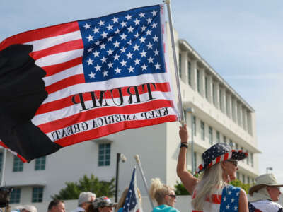 Supporters of former President Donald Trump stand outside of the Alto Lee Adams Sr. U.S. Courthouse as they await his arrival on March 1, 2024, in Fort Pierce, Florida.