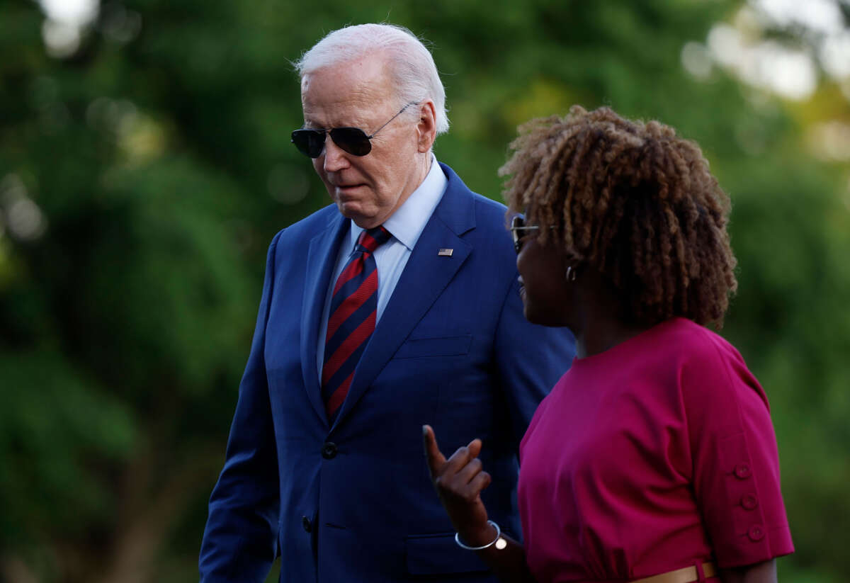 President Joe Biden walks with White House Press Secretary Karine Jean-Pierre as they return to the White House on May 2, 2024, in Washington, D.C.