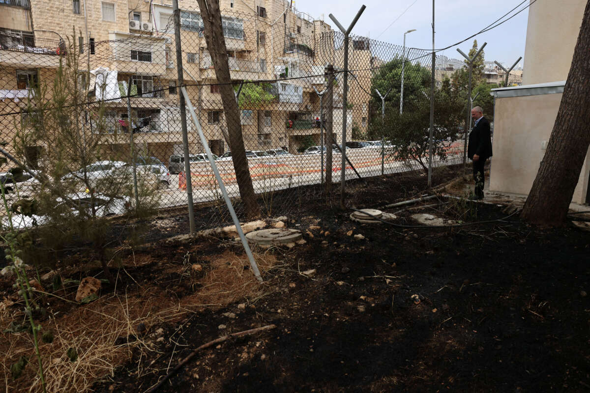 United Nations Relief and Works Agency for Palestine Refugees (UNRWA) Affairs Director in the West Bank Adam Bouloukos visits the agency's headquarters in east Jerusalem, where the traces of a fire are visible after Israeli extremists reportedly set ablaze the perimeter of the building on May 10, 2024.