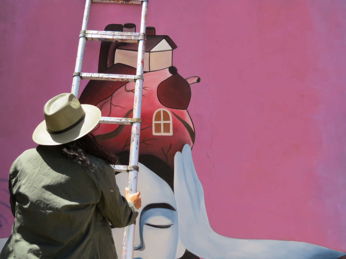 Locals in La Magdalena Tlaltelulco paint a mural in defense of their territory and identity.