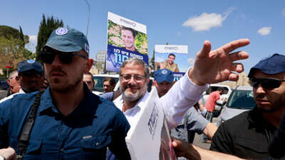 Israel's far-right National Security Minister Itamar Ben Gvir greets supporters as he arrives to join a protest calling for the continuation of the war efforts, near the prime minister's office in Jerusalem on May 5, 2024.
