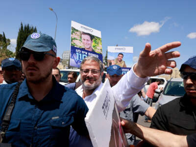 Israel's far-right National Security Minister Itamar Ben Gvir greets supporters as he arrives to join a protest calling for the continuation of the war efforts, near the prime minister's office in Jerusalem on May 5, 2024.